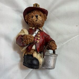 Adorable Firefighter Bear Figurine holding fire hose and bucket with helmet on